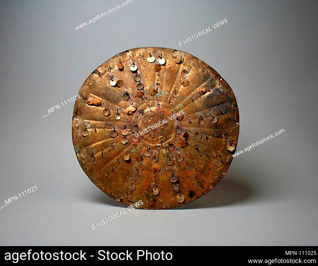 Disc. Date: 390-450; Geography: Peru; Culture: Moche (Loma Negra); Medium: Gilded copper; Dimensions: Diameter 6-7/8 in. (17