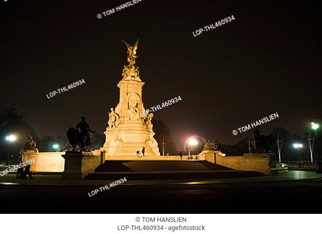 England, London, Westminster, The Victoria Memorial lit-up in Queen's Gardens in front of Buckingham Palace at night