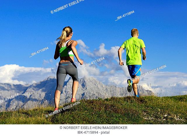 Hikers, Trail running on the Eggenalm, behind Loferer Steinberge, Reit im Winkl, Upper Bavaria, Bavaria, Germany