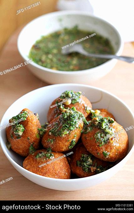 Icli kofte (stuffed bulgur dumplings, Turkey) with spinach and pesto