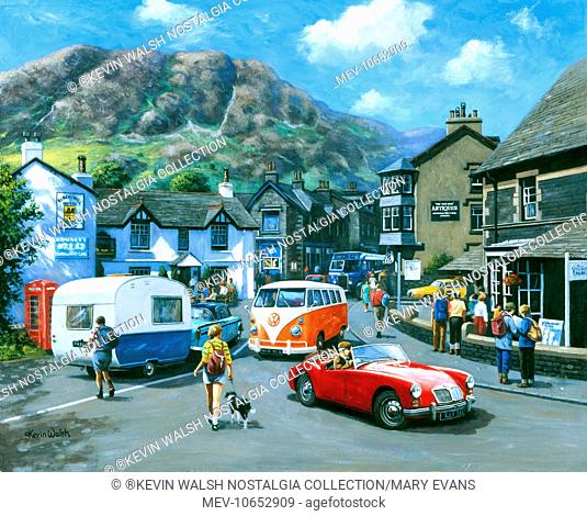 Scene at Coniston in the Lake District, with a red MG MGA sports car, a Volkswagen campervan and other vehicles on a busy road