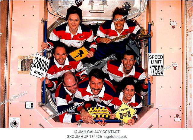 The seven crew members for STS-96 pose for an inflight crew portrait at the completion of their assigned chores on the International Space Station (ISS)