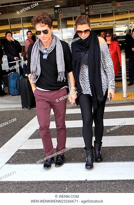 TV presenter Daisy Fuentes arrives on a flight to Los Angeles International Airport (LAX) Featuring: Daisy Fuentes, Richard Marx Where: Los Angeles, California