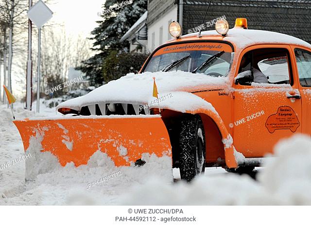 A clearance car removes snow off the street in Usseln,  Germany, 06 December 2013. Storm front Xaver has reached the Northern Germany