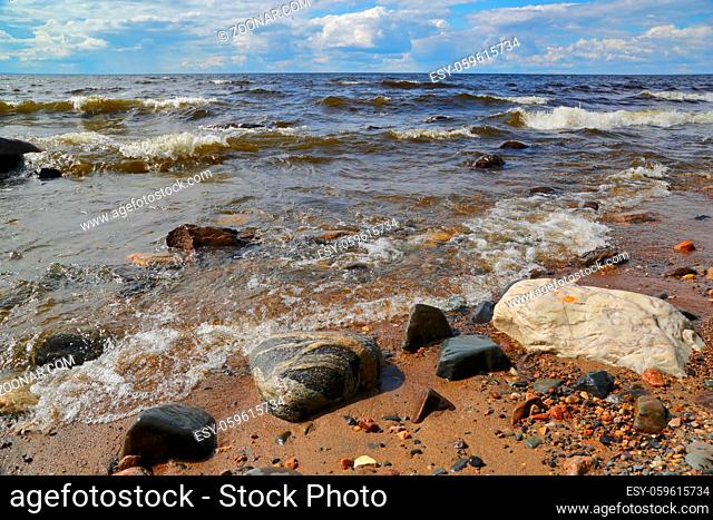 Waves on shore of Onega lake in Karelia, Russia