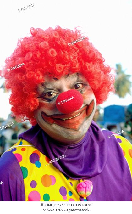Smiling clown with red hair