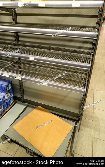 View of empty shelves in a supermarket because of Covid-19 panic shopping