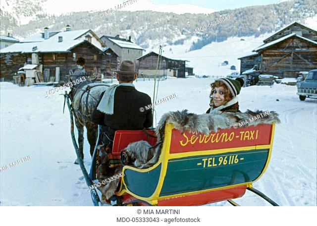 The singer Mia Martini (Domenica Rita Adriana Bertè) on a horse-drawn sleigh. Livigno, Italy. 1973
