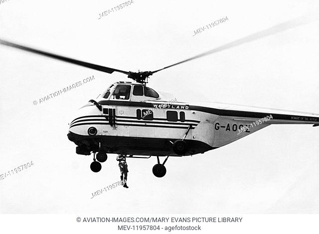 Civil Demonstrator Westland Ws-55 Whirlwind with a Long-Line Winch Hauling a Man