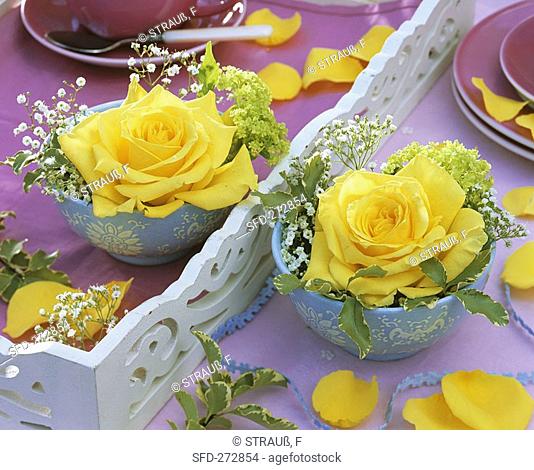 Yellow roses with Gypsophila and Viburnum