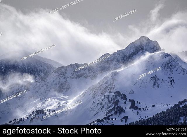 Clouds over the summits of Port de Vielha in winter. The highest peak is the Tuc de Montanèro (Aran Valley, Catalonia, Spain, Pyrenees)