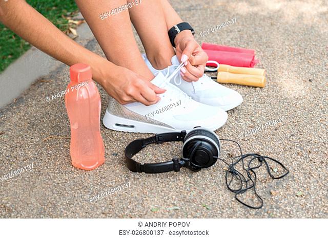 Female Runner Trying Running Shoes Getting Ready For Jogging