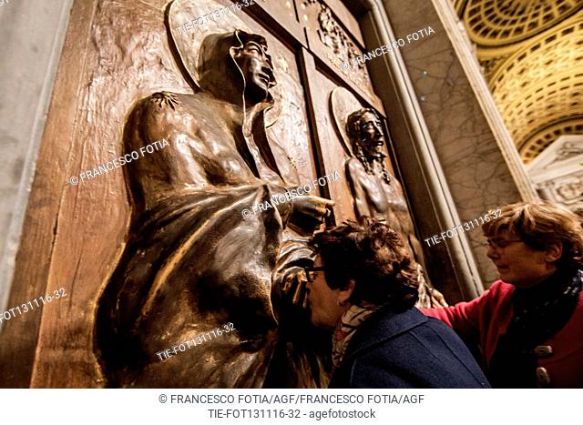Faithful touching the Holy Door at Basilica of St. Maria Maggiore, Rome, ITALY-13-11-2016