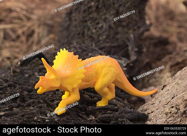 infrared image of the dinosaur toys on the dried deforested land