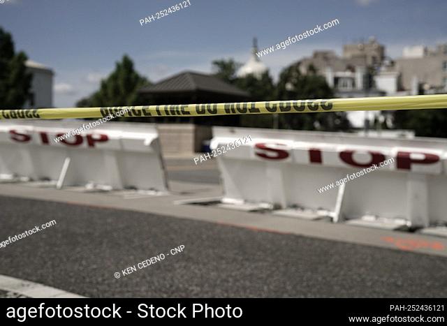 Yellow tape indicates a perimeter as United States Capitol Police (USCP) investigate a truck bomb on First Street, Southeast between the Library of Congress...