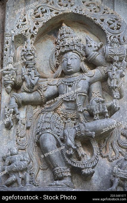 Dancing Shiva sculpture, Kedareshwara Temple façade, Halebidu, Karnataka, India