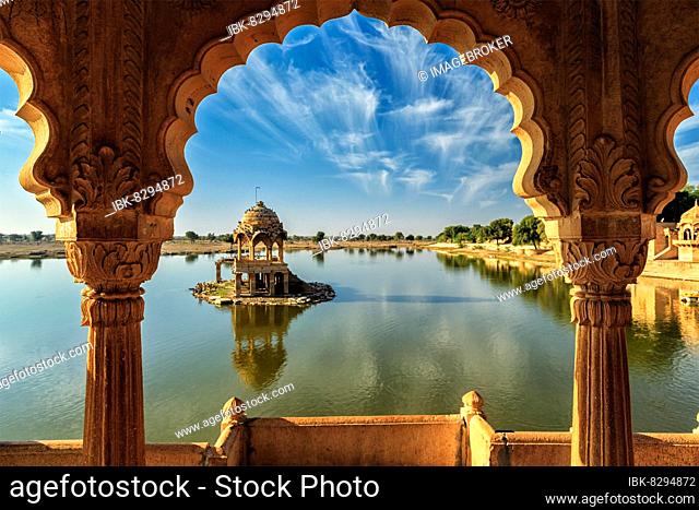 Indian landmark Gadi Sagar, artificial lake view through arch. Jaisalmer, Rajasthan, India, Asia