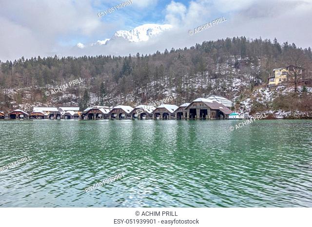 Scenery including lots of boathouses at Schoenau am Koenigssee in Bavaria at winter time
