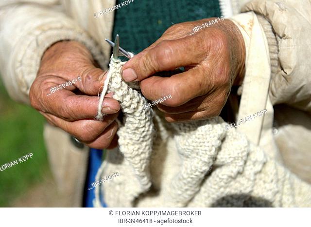 Hands of a knitting old woman, Chuquis, Huanuco Province, Peru