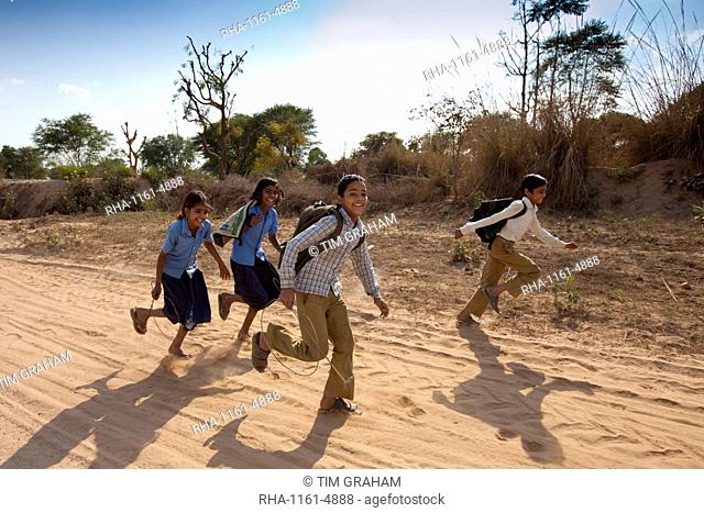 Indian schoolboys and girls walking to school at Doeli in Sawai Madhopur, Rajasthan, Northern India