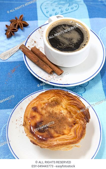 Typical Portuguese breakfast with expresso coffee and egg custard pastry