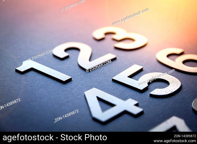 Mathematics background made with solid numbers from 1 to 9 - Closeup view