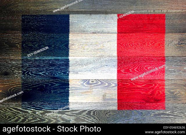 A France flag on rustic old wood surface background