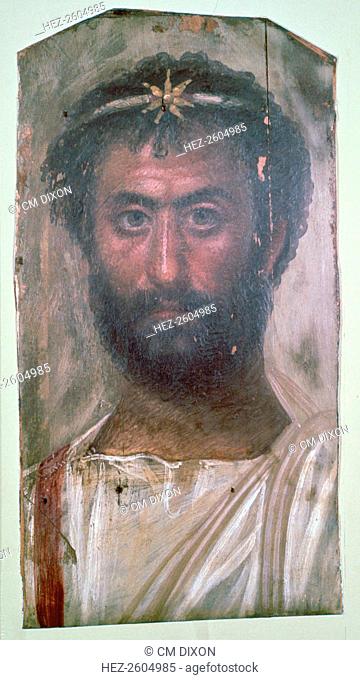 Roman period Egyptian wax portrait of a man from a tomb in Hawara, c140-160. The gold star on his forehead shows he is a priest of the sun