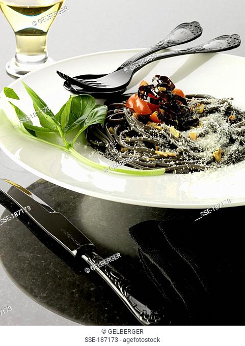Squid ink spaghetti with purple peppers