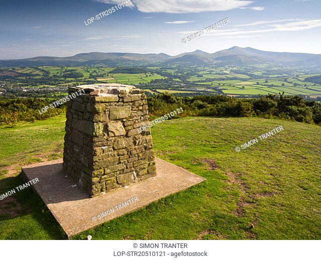 Wales, Powys, Brecon. Trig point on top of Pen-y-Crug hillfort overlooking Brecon and the Usk valley in the Brecon Beacons National Park