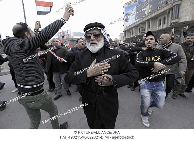 15 February 2019, Iraq, Baghdad: Supporters of Iraqi Shiite cleric Moqtada al-Sadr take part in a demonstration on the 2nd anniversary of the killing of...