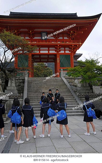 School boys wearing Prussian uniforms and school girls wearing uniforms with sailor collars in front of the Kiyomizu Temple complex, Kiyomizu Temple in Kyoto