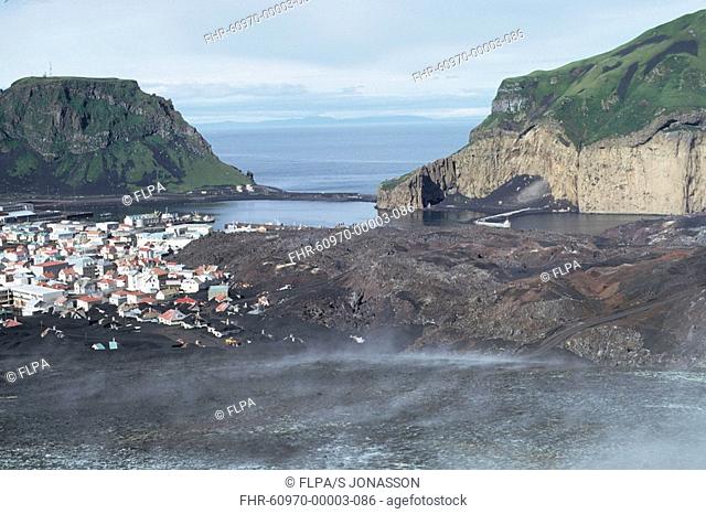 Volcanic eruption, town and lava flows, after eruption, Eldfell Volcano, Heimaey, Westmann Isles, Iceland, 1973