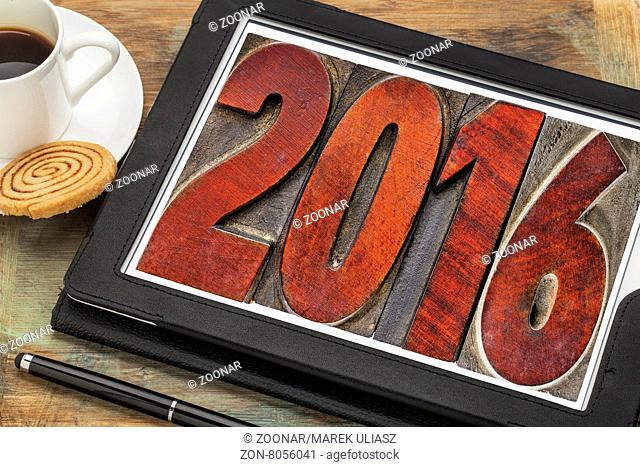 2016 text in vintage letterpress wood type on a digital tablet - New Year concept