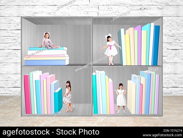 Miniatures of little girls standing in bookshelf