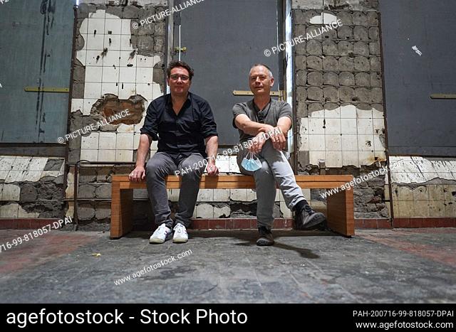 14 July 2020, Berlin: The artists Hannes Strobl (l) and Sam Auinger sit in the sound installation ""Eleven Songs"" in the hall at Berghain