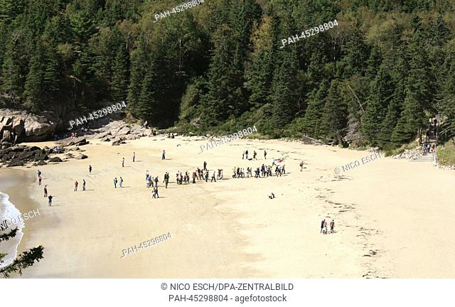 A group of tourists explores the 'Sand Beach' in the Acadia National Park in Maine, USA, 27 September 2013. The Acadia National Park is known for its rugged...