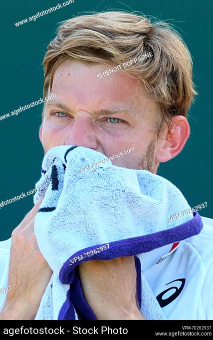 Belgian David Goffin wipes his face during a break in a tennis match between Belgian Goffin and Russian Rublev, in round three of the men's singles at the 2023...