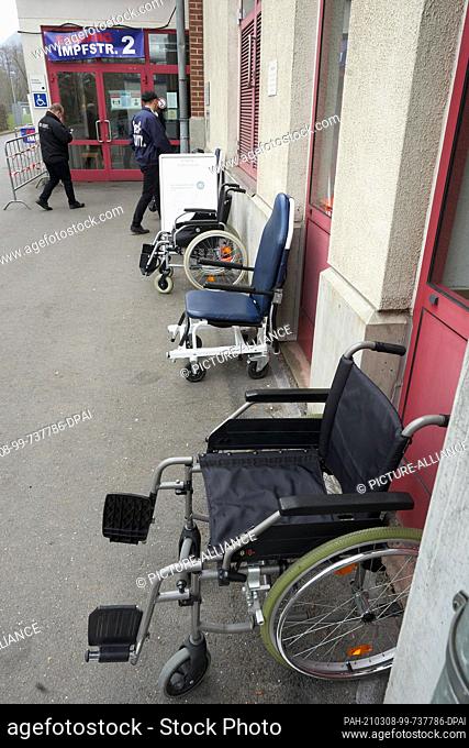 08 March 2021, Rhineland-Palatinate, Koblenz: Wheelchairs stand in front of the entrance of a vaccination centre in Koblenz