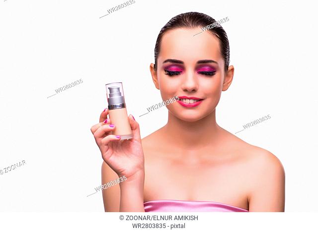 Woman with a bottle of cream isolated on white
