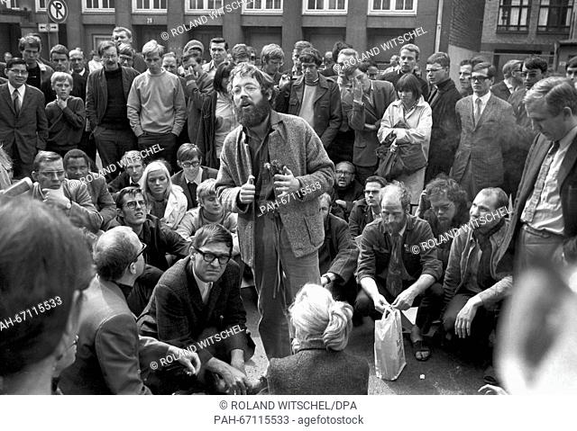 Fritz Teufel (centre, with full beard) is among the demonstrators who had organised a peaceful sit-in in front of the police headquarters of Frankfurt on 10...