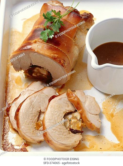 Rolled roast suckling pig with prunes and apricots