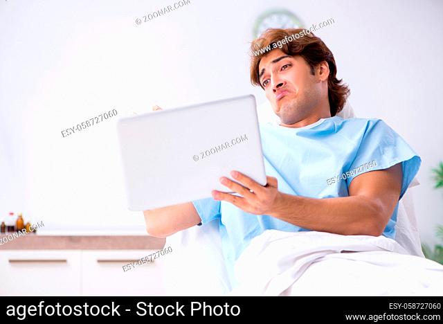 Young male patient lying on couch in hospital