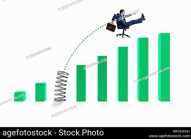 Business people jumping over bar charts