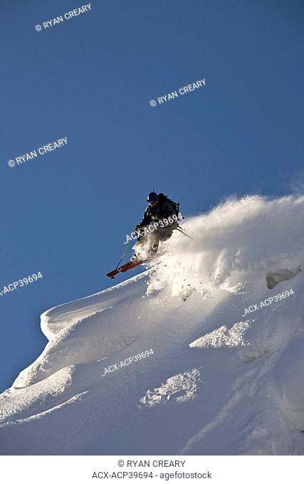 A male freeskier backcountry skiing in Roger's Pass, Glacier National Park, British Columbia, Canada