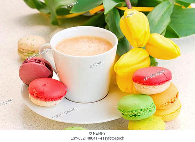 breakfast with coffee, fresh tulips and macaroons