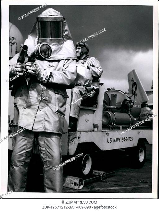 Dec. 12, 1967 - Clad in an asbestos 'Hot Suit' a member of the crash and salvage crew prepared to spray 'Purple K, ' a mixture of Potassium carbonate and 'light...