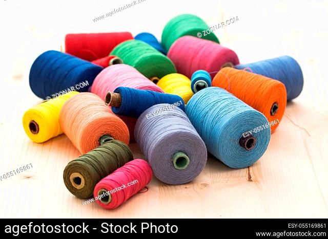 Tailoring. Many colorful threads on the table