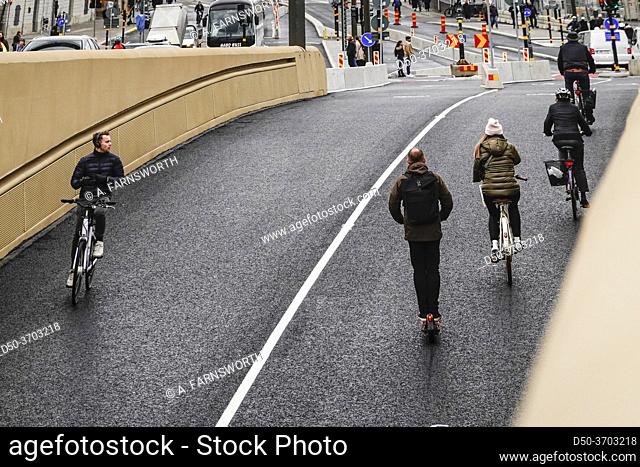 Stockholm, Sweden 27 October, 2020 Bicyclists on the new Slussbron, or Golden Bridge at Slussen, inaugurated Oct 25, 2020