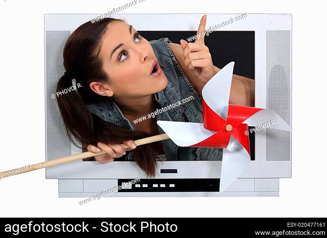 Woman escaping from television screen